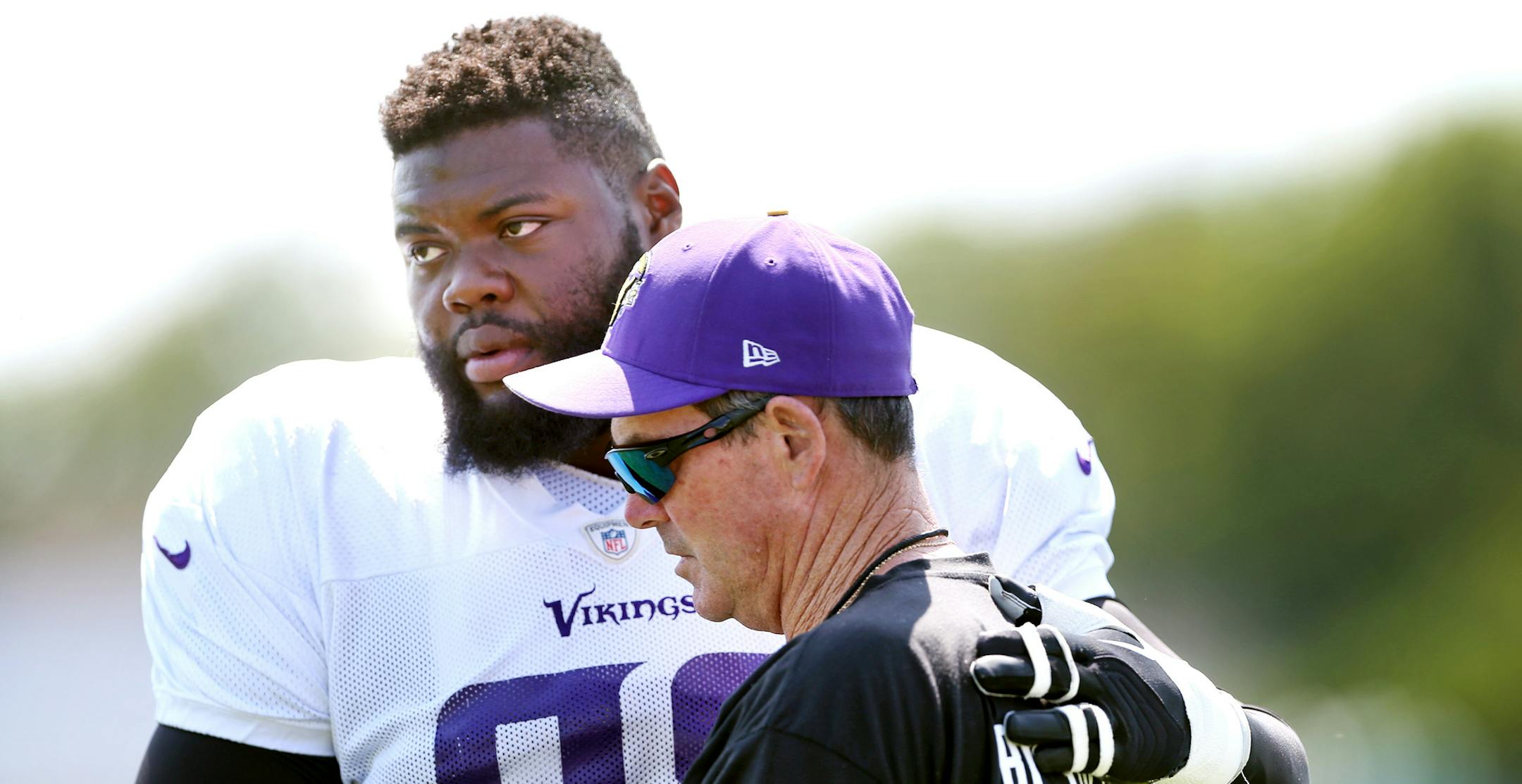Vikings tackle Linval Joseph hugged head coach Mike Zimmer at Minnesota State University Mankato Wednesday August 12, 2015 in Mankato, MN. Vikings head coach Mike Zimmer's father, Bill, passed away on Tuesday in Naples, Fla. He was 84. ] Jerry Holt/ Jerry.Holt@Startribune.com