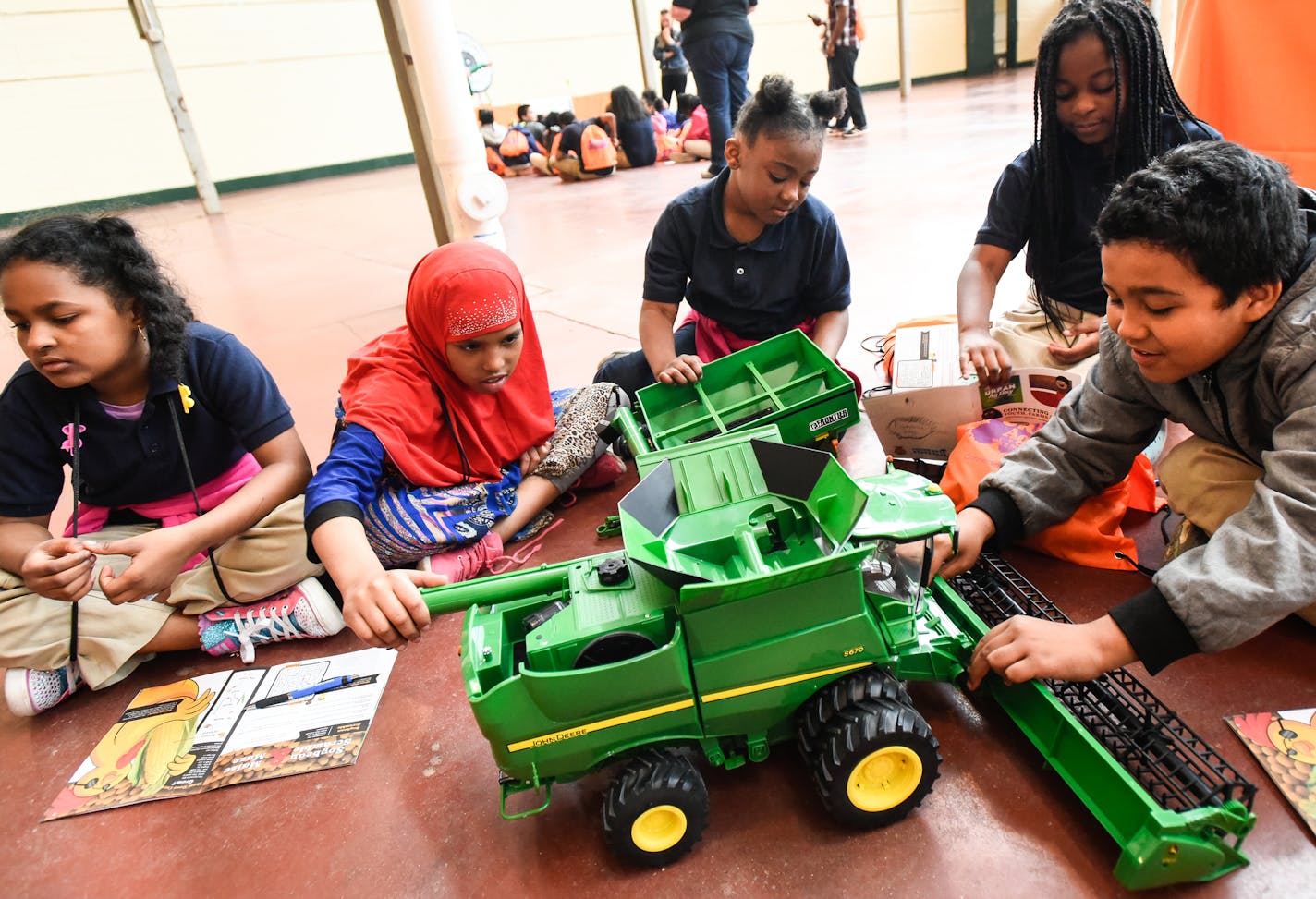 Jenny Lind Elementary third-graders played with a model combine during a demonstration about the importance of soybeans.