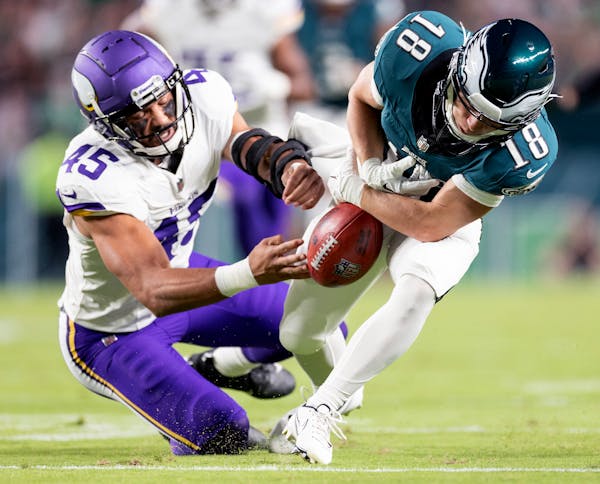 Minnesota Vikings Troy Dye (45) forces a fumble on (18) of the Philadelphia Eagles in the first quarter Thursday, Sept. 14, 2023, at Lincoln Financial