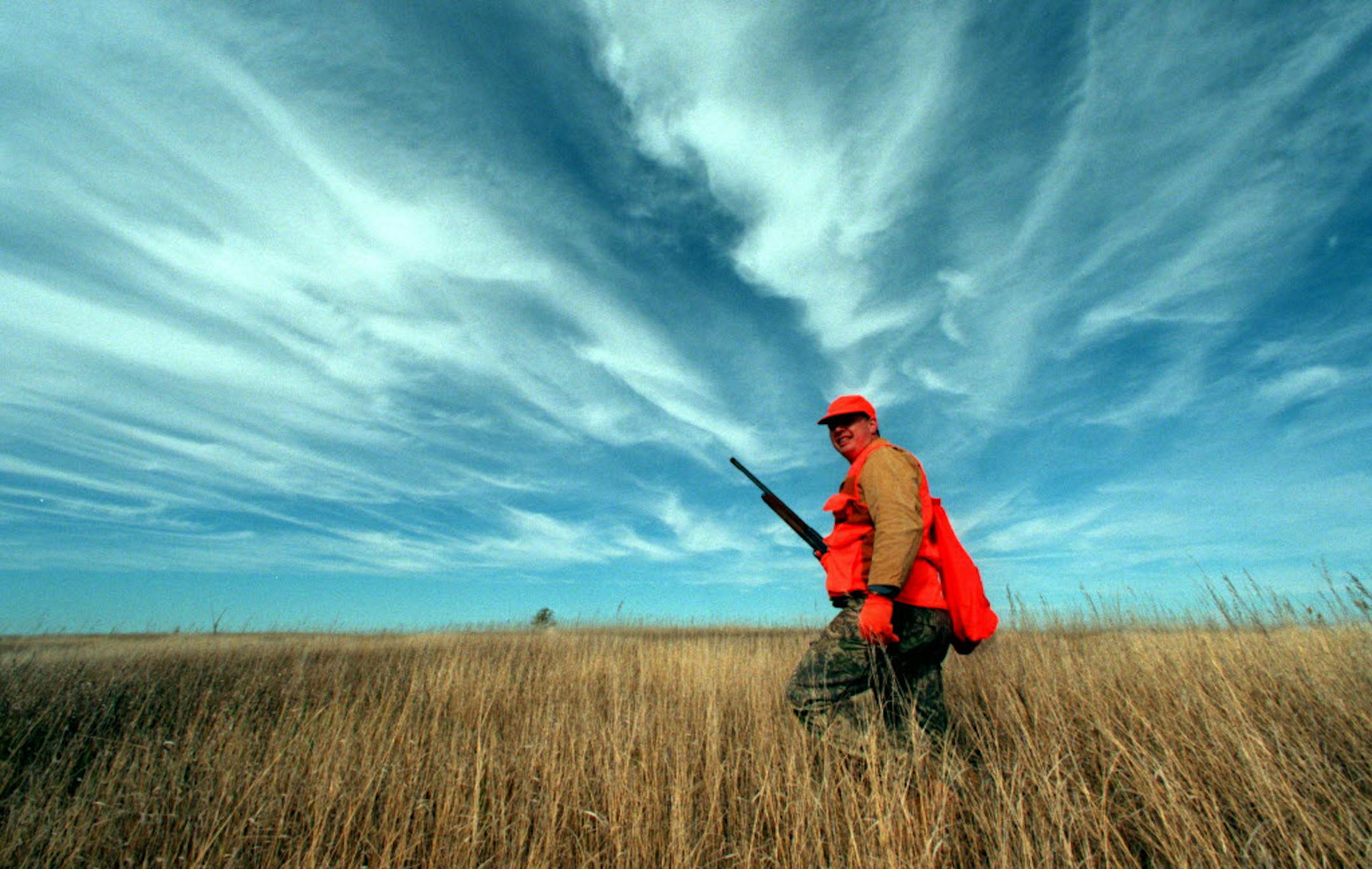 MARK OLSON OF LITTLE CANADA WALKS THE BIG-SKY COUNTRY OF SOUTH DAKOTA IN SEARCH OF RING-NECK PHEASANTS DURING A RECENT HUNT IN THE CENTRAL PART OF THE STATE WITH FELLOW MINNESOTA HUNTERS. ORG XMIT: MIN2013120512231228