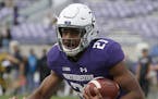 Northwestern's Justin Jackson warms up before an NCAA college football game against Iowa Saturday, Oct. 21, 2017, in Evanston, Ill. (AP Photo/Jim Youn