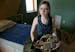 Anessa DeMers, a senior at Elk River High School, sat in her room with her French horn, one of three instruments she plays at her home in Nowthen, Min