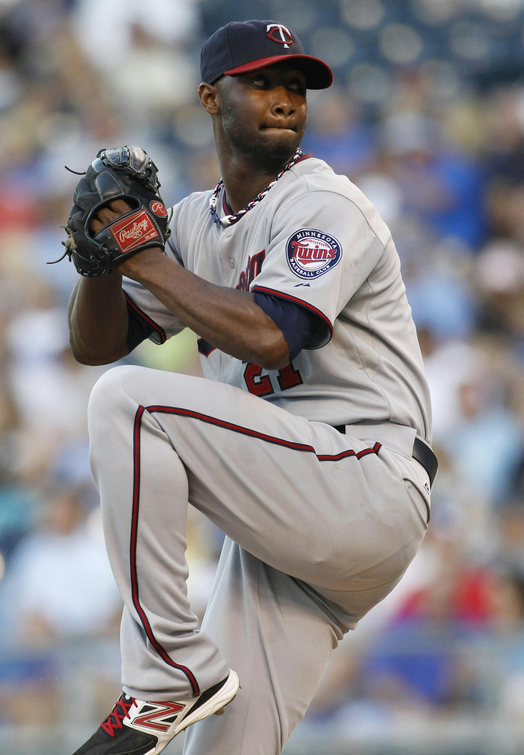 Minnesota Twins pitcher Samuel Deduno throws to home plate in the first inning of a baseball game against the Kansas City Royals at Kauffman Stadium in Kansas City, Mo., Wednesday, Aug. 7, 2013. (AP Photo/Colin E. Braley)