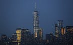 One World Trade Center dominates the New York city skyline as seen from New York harbor, Tuesday, July 7, 2015, in New York. (AP Photo/Kathy Willens)