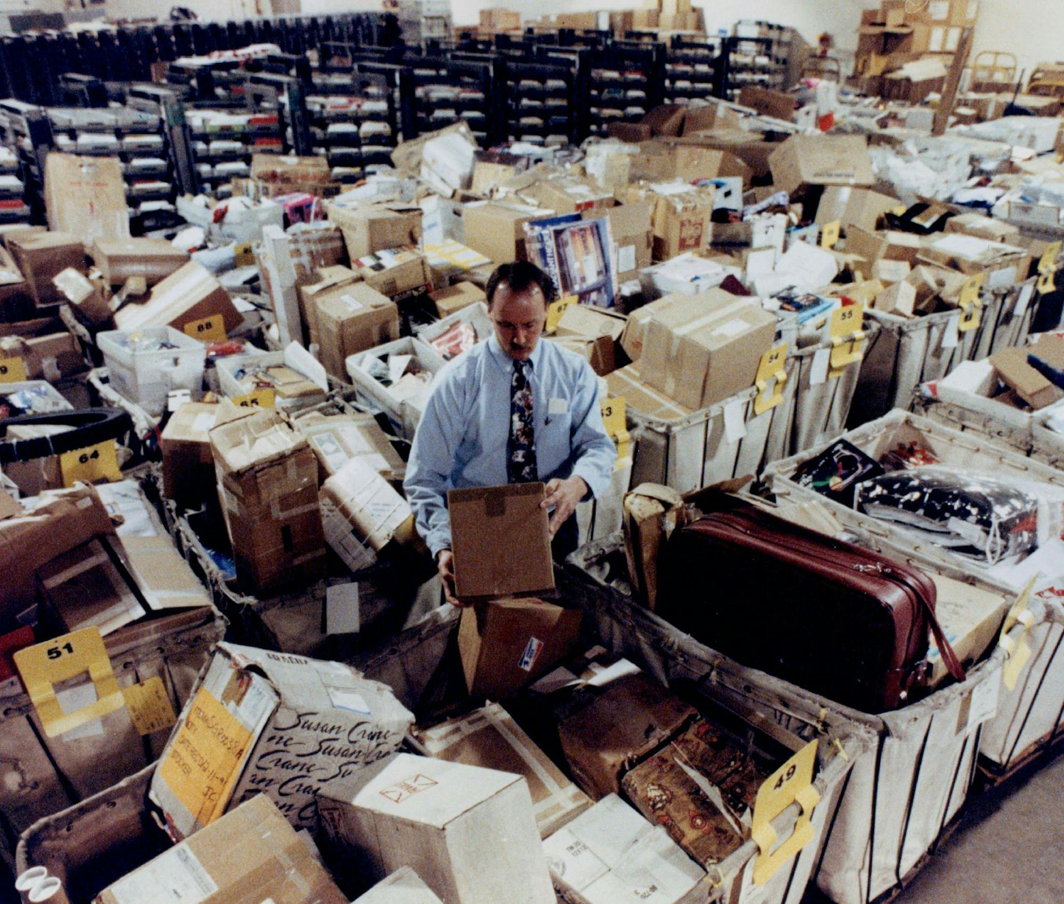 Web servers are the e-mail equivalent of the U.S. Postal Service's dead letter office in St. Paul, seen here in 1992. The government needs a search warrant to look into your mail, but old e-mails stored on a server somewhere don't have the same protection. Some in Congress want that to change.