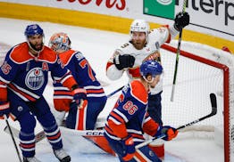 The Panthers' Sam Bennett (9) celebrates his goal as the Oilers' Darnell Nurse (25), Philip Broberg (86) and goalie Stuart Skinner (74) look on during