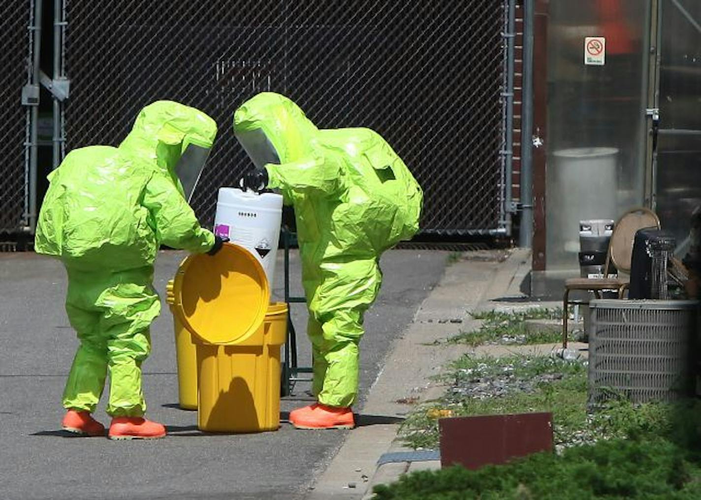 A hazardous materials crew contain the chemical spill that occurred at the Crowne Plaza Hotel in Eagan.