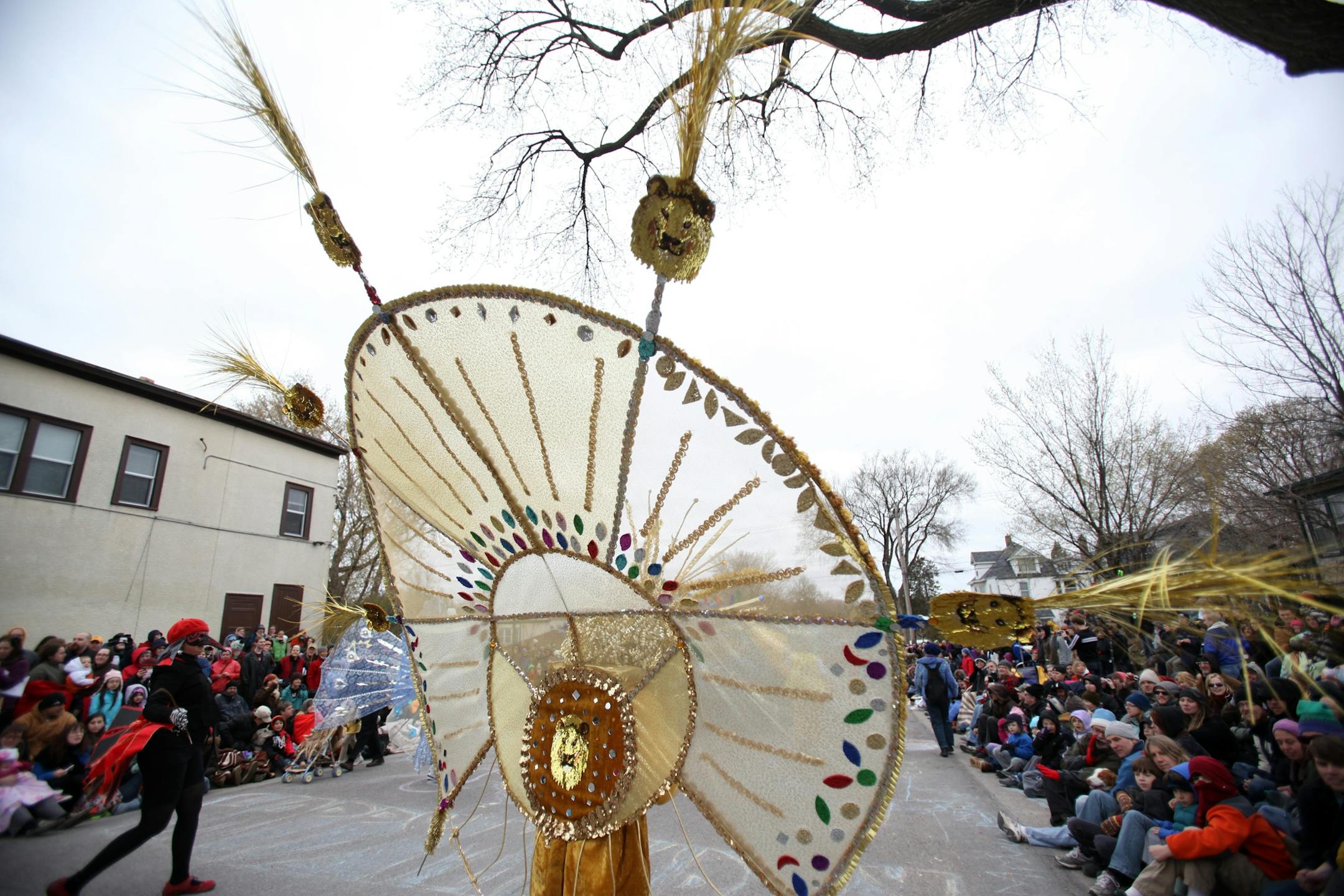 Crowds watched the elaborate costumes in the Heart of the Beast Theatre's May Day parade in 2011.