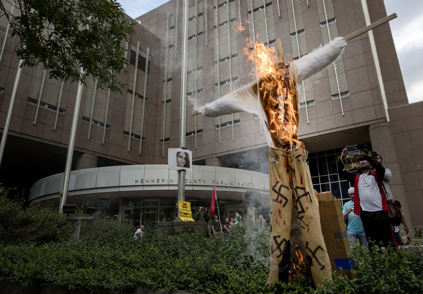 Demonstrators burned a swastika covered figure during the Solidarity with anti-racists in Charlottesville march that ended in downtown Minneapolis on Monday. ] CARLOS GONZALEZ &#xef; cgonzalez@startribune.com - August 14, 2017, Minneapolis, MN, Solidarity march with anti-racists in Charlottesville. Starts at Republican HQ