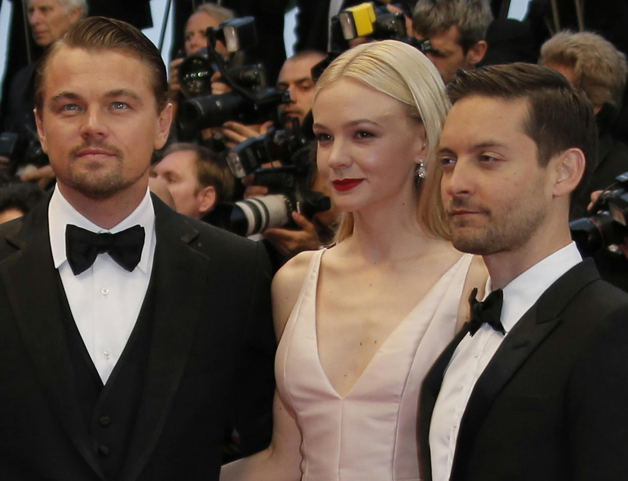 Cast members from left, Amitabh Bachchan, Leonardo DiCaprio, Carey Mulligan and Tobey Maguire pose as they arrive for the opening ceremony and the screening of The Great Gatsby at the 66th international film festival, in Cannes, southern France, Wednesday, May 15, 2013. (AP Photo/Francois Mori)