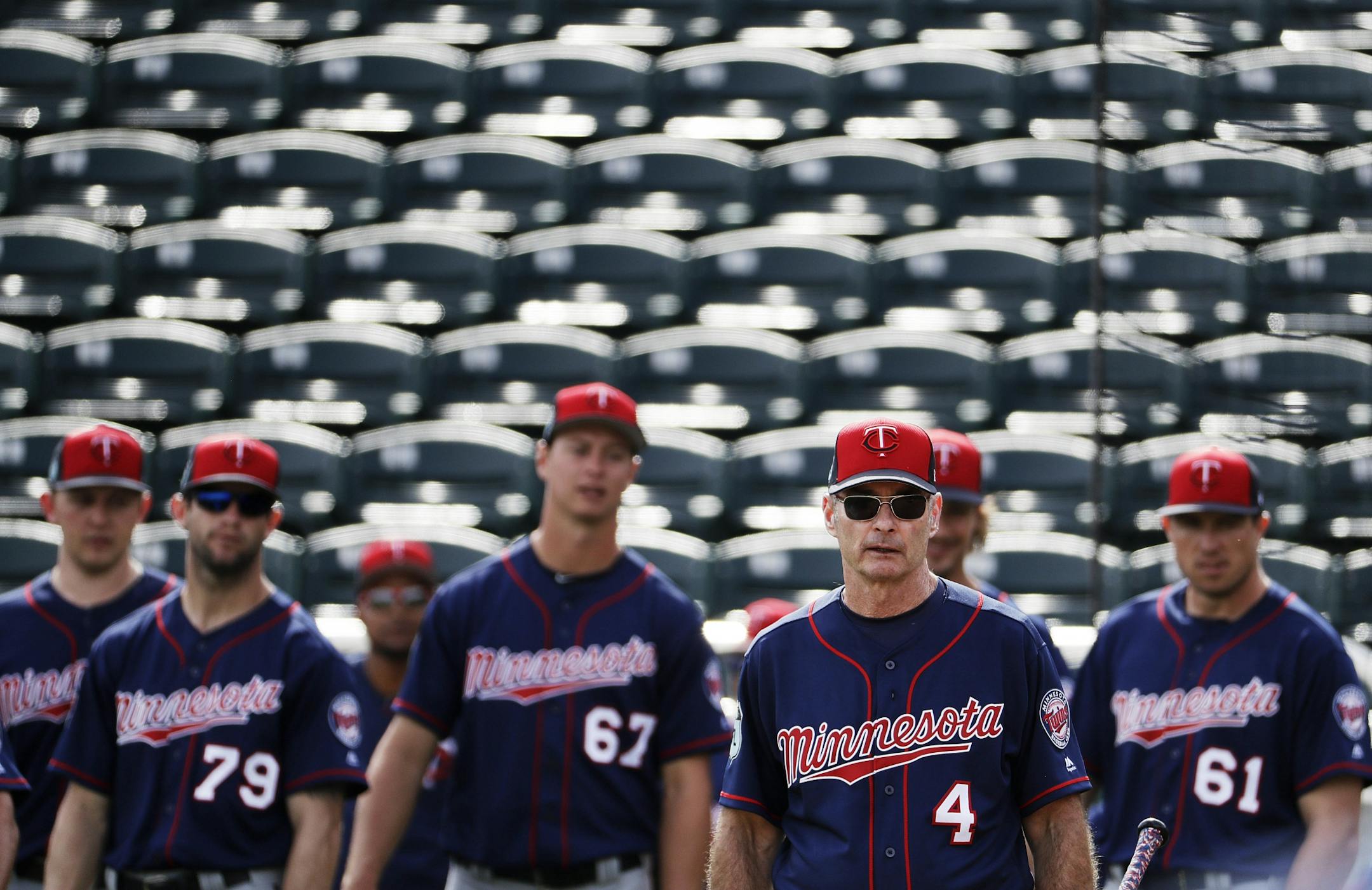 Minnesota Twins manager Paul Molitor, second from right, watches over a spring training baseball workout in Fort Myers, Fla., Tuesday, Feb. 21, 2017.