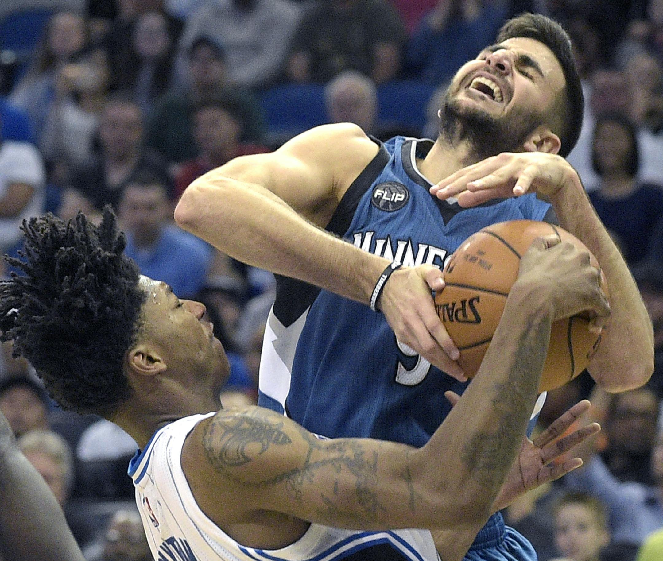 Orlando Magic guard Elfrid Payton, left, ties up Minnesota Timberwolves guard Ricky Rubio (9) for a jump ball during the second half of an NBA basketball game in Orlando, Fla., Wednesday, Nov. 18, 2015. The Magic won 104-101. (AP Photo/Phelan M. Ebenhack)