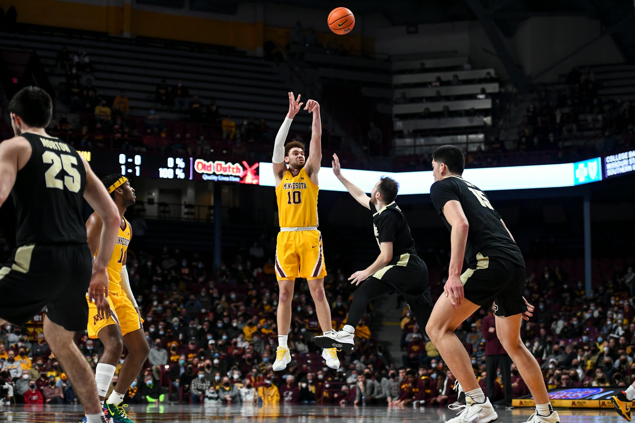 Minnesota Gophers forward Jamison Battle (10) scores a 3-pointer against Purdue during an NCAA men's basketball game between Minnesota and Purdue at Williams Arena in Minneapolis, Minn.