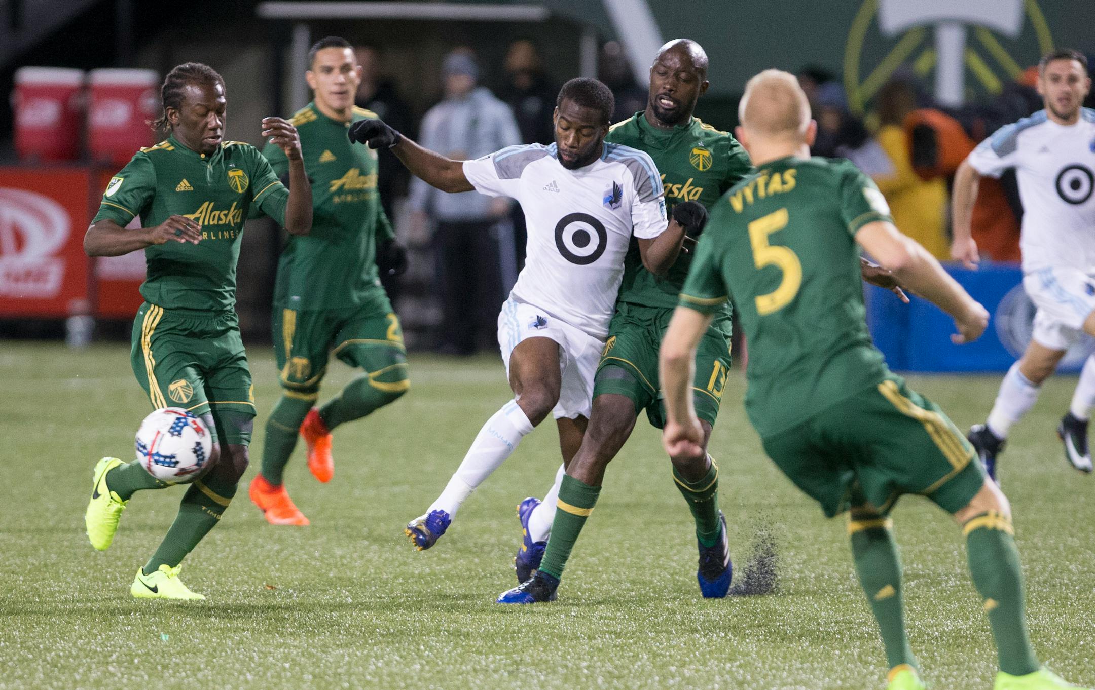 Minnesota United midfielder Kevin Molino (18) passes during the first half of an MLS soccer game against the Portland Timbers in Portland, Ore., Mar. 3, 2017.