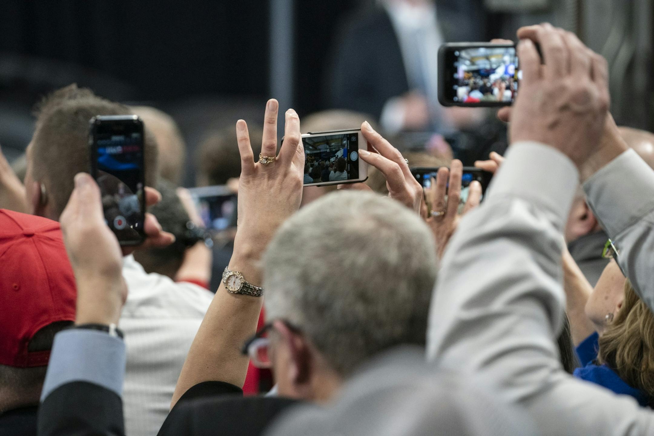 People in the crowd photographed with their phones as President Donald J. Trump spoke Nuss Truck and Equipment in Burnsville for a roundtable discussion on tax cuts and the U.S. economy in Burnsville, Minn., on Monday, April 15, 2019.