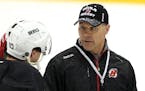 In 2014 Scott Stevens, right, with defenseman Peter Harrold, was a coach with his old team, the New Jersey Devils. Now with the Wild, Stevens, unselfi