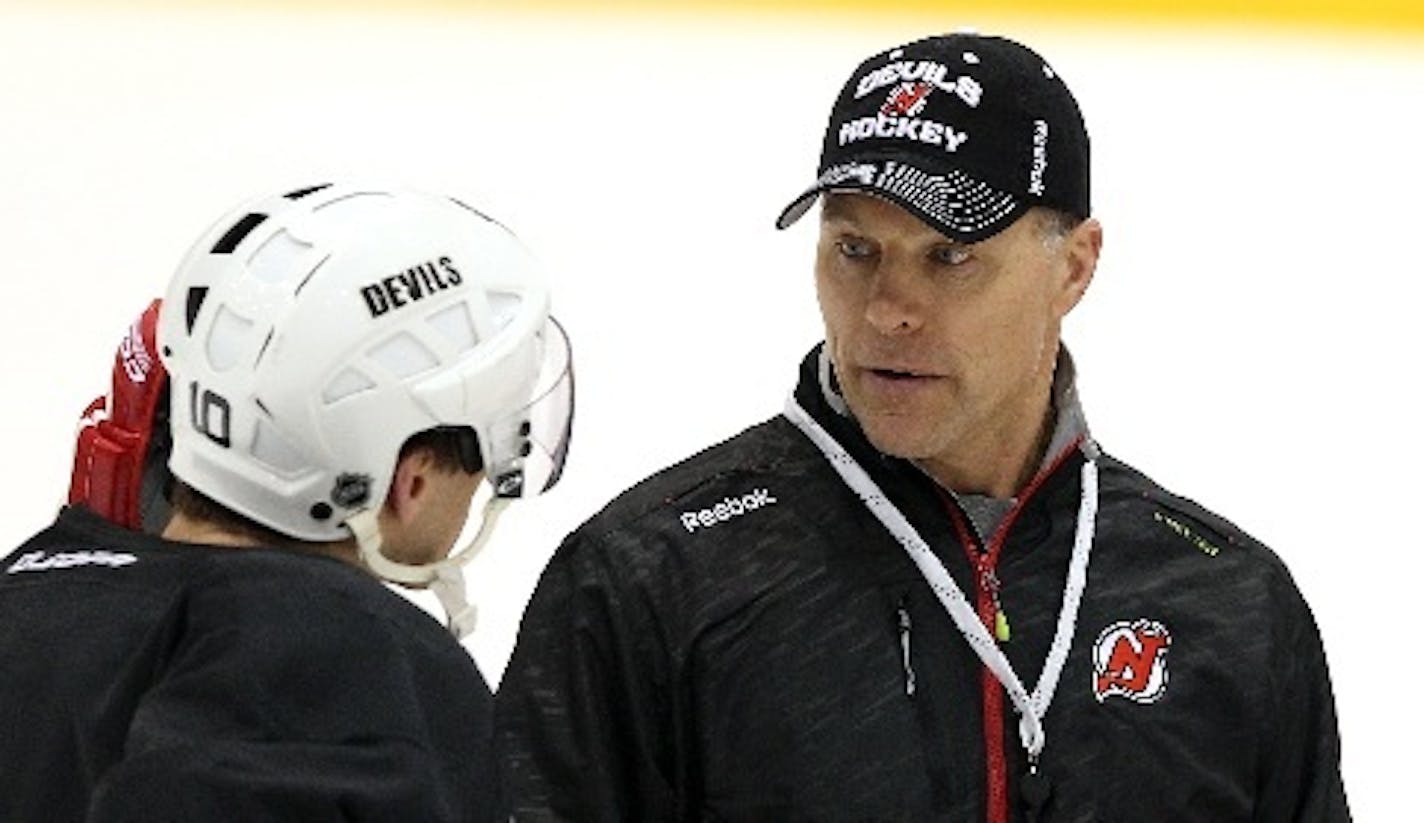 In 2014 Scott Stevens, right, with defenseman Peter Harrold, was a coach with his old team, the New Jersey Devils. Now with the Wild, Stevens, unselfish as a player, is equally generous as a teacher.