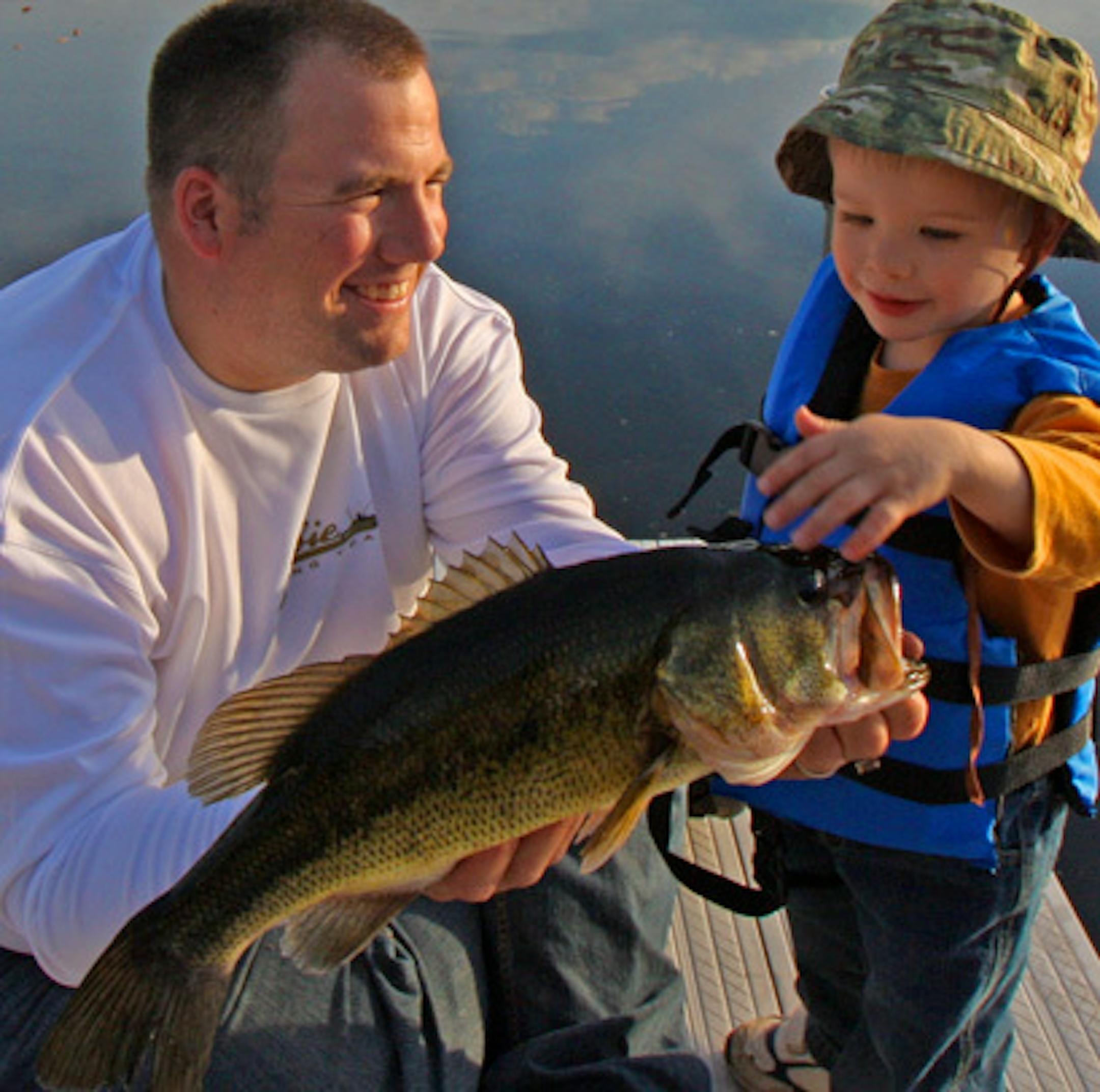 The author with a "rockin' big bass" as his two-year old likes to call it (legitimately caught by said two year old)