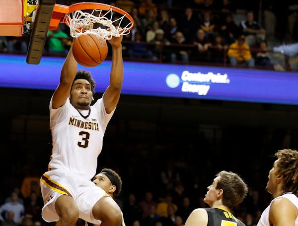 Gophers forward Jordan Murphy dunked against Iowa in the second half of Minnesota's 101-89 double overtime victory Wednesday. ] CARLOS GONZALEZ � cg