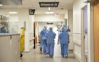 A group of healthcare workers walked through one of the hallways of St. Luke's Emergency Department as staff began to get acclimated with the new spac