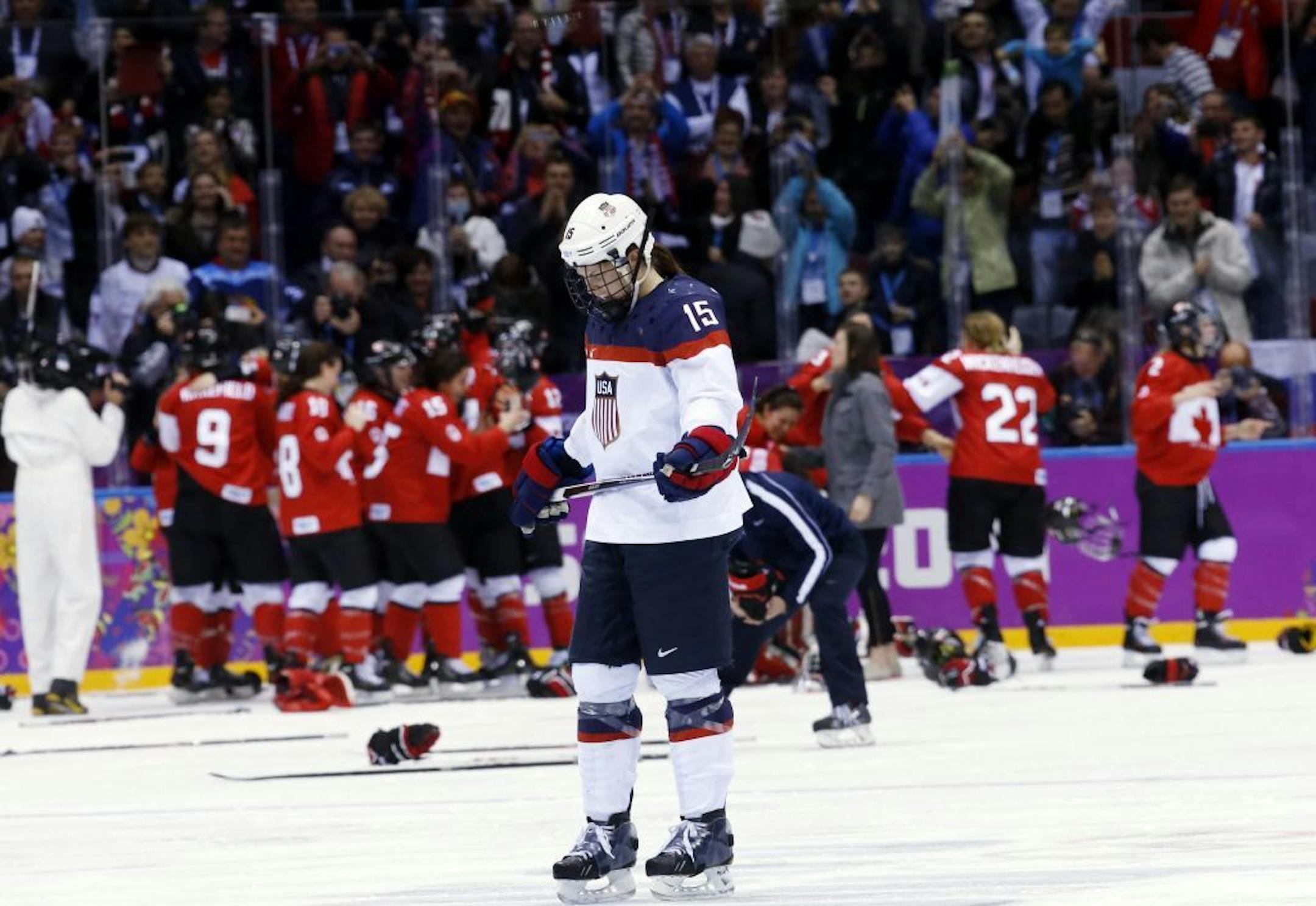 Gophers hockey player and Team USA member Anne Schleper (15) skates back to the bench after Canada scored in overtime to win the women's gold medal ice hockey game 3-2 at the 2014 Winter Olympics, Thursday, Feb. 20, 2014, in Sochi, Russia.