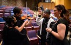 From left, choir and orchestra students Nevaeh Embaye, Cam Toal, Toshio Miller and Kenzie Finne converse during intermission at South High’s spring 