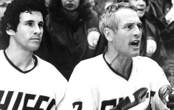 April 2, 1977 Slap Shot A tense moment for their usually inept hockey team is observed by Ned Braden (MICHAEL ONTKEAN) and Reggie Dunlop (PAUL NEWMAN)
