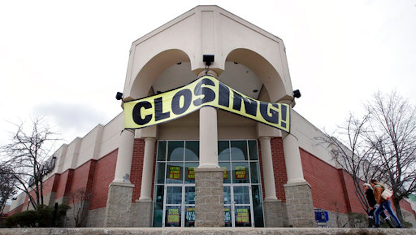 FILE- In this Feb. 23, 2018, file photo, customers enter a Bon Ton store, which is scheduled to close, in Concord, N.H. Shoppers need to compare prices as they navigate the sales racks, and carefully check the quality of the merchandise since they can't return items. (AP Photo/Charles Krupa, File)