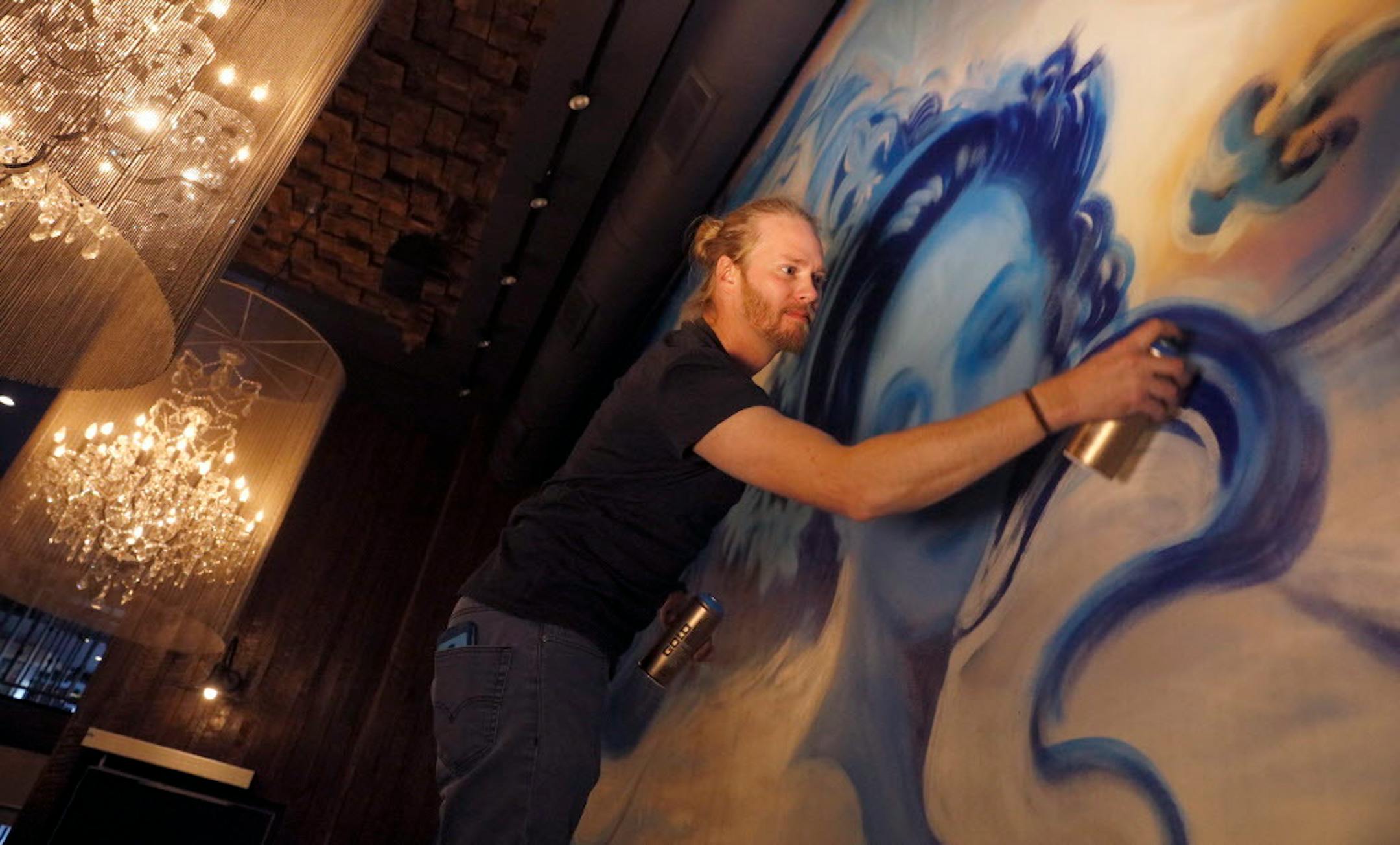 Adam Dennis spray-painted a mural in the private dining area of Coup d'Etat.