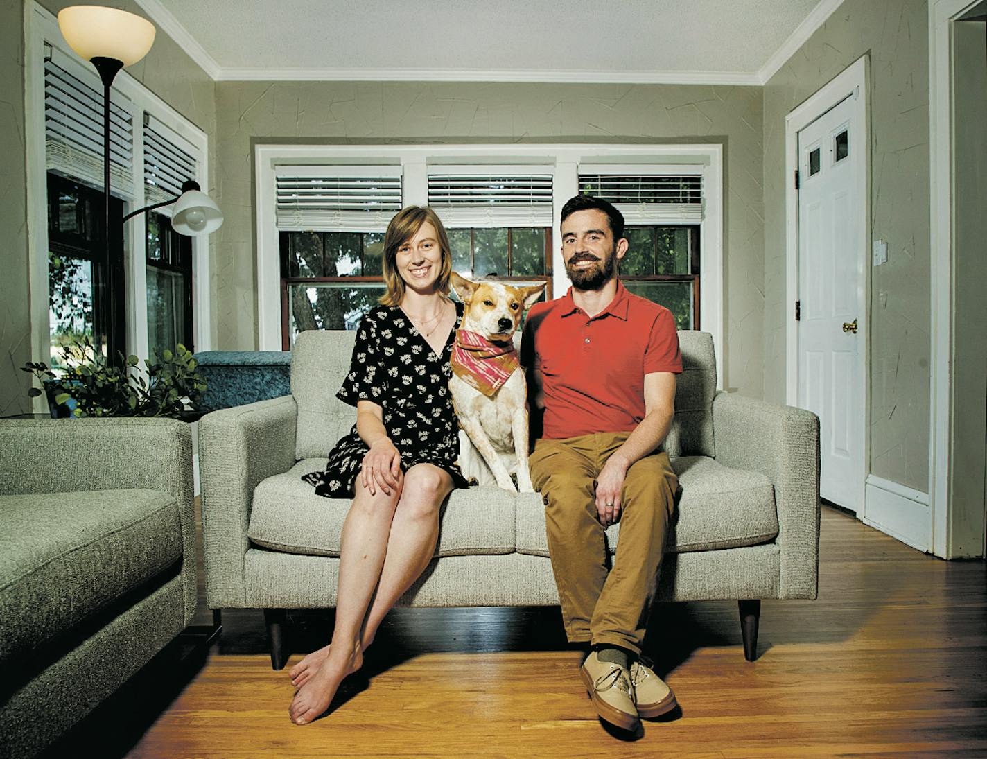 Kristen and Jake, with Penny, in their light-filled living room.