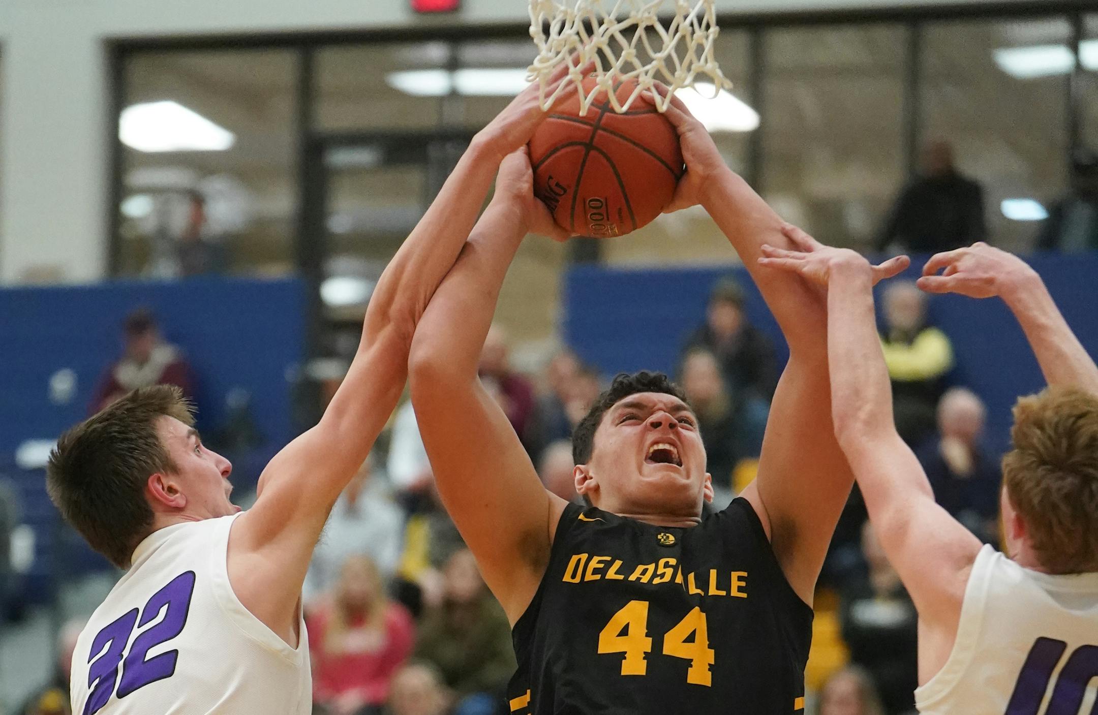 DeLaSalle player Jalen Travis.(44) battles against Camden Carter (32) and Connor Behrens (10).] Class 3A, Section 6 boys' basketball section final, DeLaSalle vs. Waconia at Chanhassen HS.RICHARD TSONG-TAATARII ¥ richard.tsong-taatarii@startribune.com