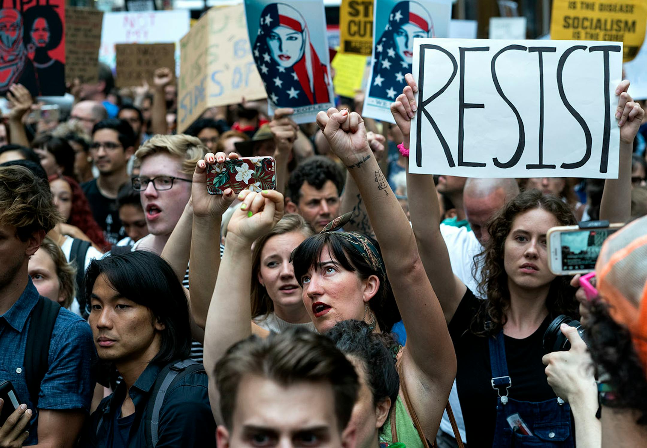 Protestors gather near Trump Tower in New York Monday, Aug. 14, 2017, as they protest against President Donald Trump.