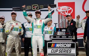 Denny Hamlin celebrates after winning a NASCAR Cup Series auto race at Richmond Raceway on Sunday night.