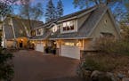A long driveway leads to Sugar Maple Cottage, named for the majestic trees that line the property, along the shores of Lake Minnetonka in Greenwood.