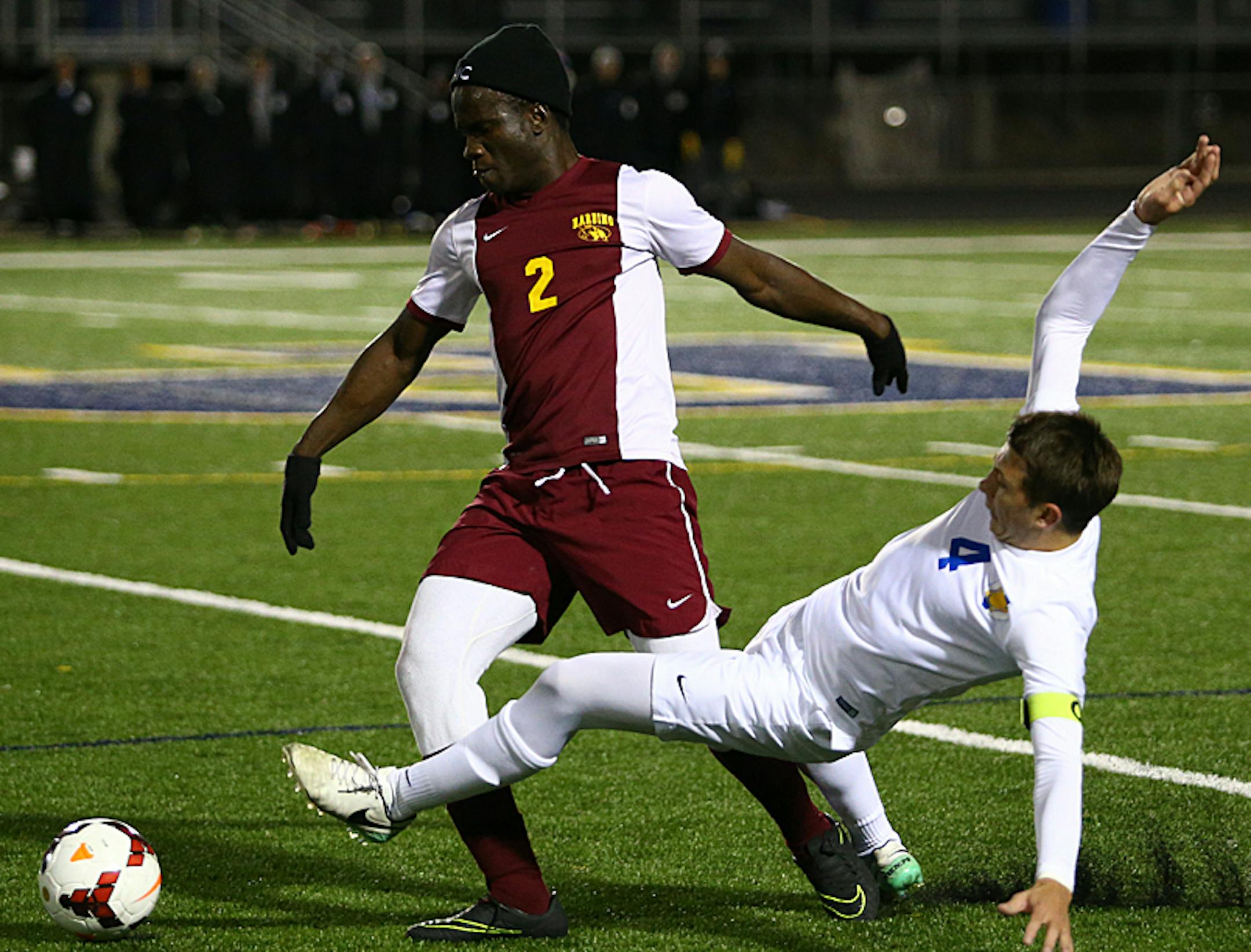 Sekou Swaray Vernon Lovegreen (2) pushes through St. Thomas Academy defender (4) gaining possession. The Knights and Cadets remain scoreless through the first half of play in the opening round of the Class 1A State Soccer Tournament at Prior Lake High School. Photo by Cheryl Myers, SportsEngine