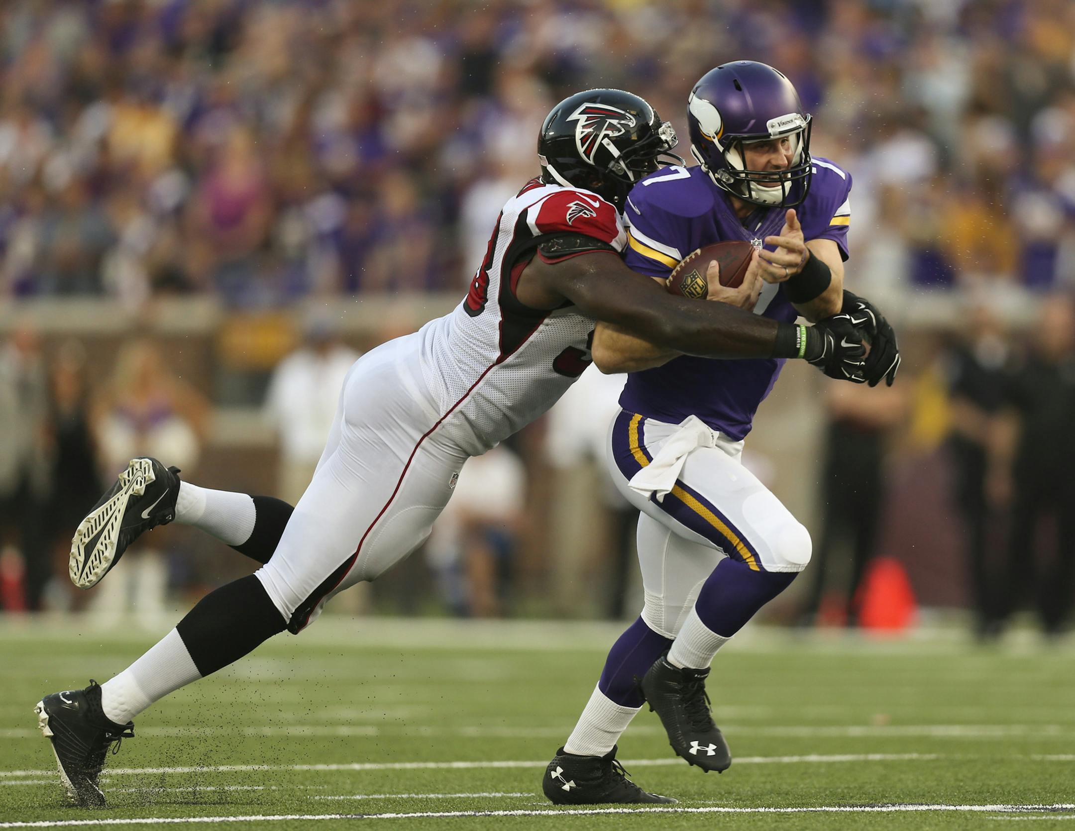 Minnesota Vikings quarterback Christian Ponder (7) broke a tackle by Atlanta Falcons defensive end Malliciah Goodman (93) while gaining a yard late in the fourth quarter Sunday afternoon at TCF Bank Stadium. ] JEFF WHEELER ‚Ä¢ jeff.wheeler@startribune.com The Vikings beat the Atlanta Falcons 41-28 Sunday afternoon, September 28, 2014 at TCF Bank Stadium in Minneapolis.