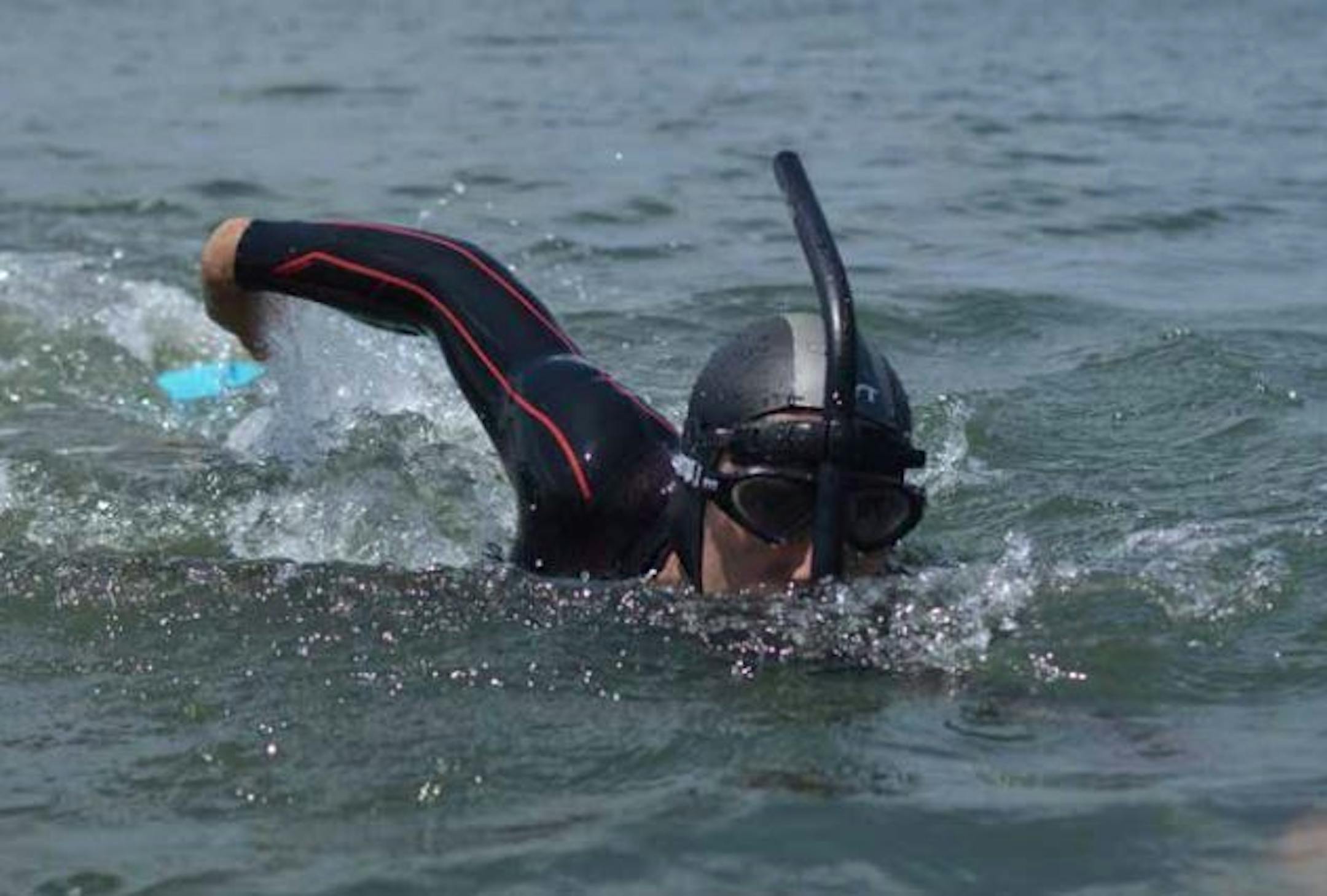 Ben Lecomte will wear a wet suit, fins and a shark repellent bracelet and will breathe through a snorkel during his Pacific Ocean swim.