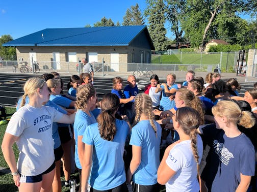 St. Anthony Village High School girls soccer co-head coaches Sue and Paul Pawlyshyn broke a huddle Monday with their varsity and junior varsity players to conclude their first practice of the fall at Dennison Field in Saint Anthony, Minnesota. Noah Furtado, Star Tribune