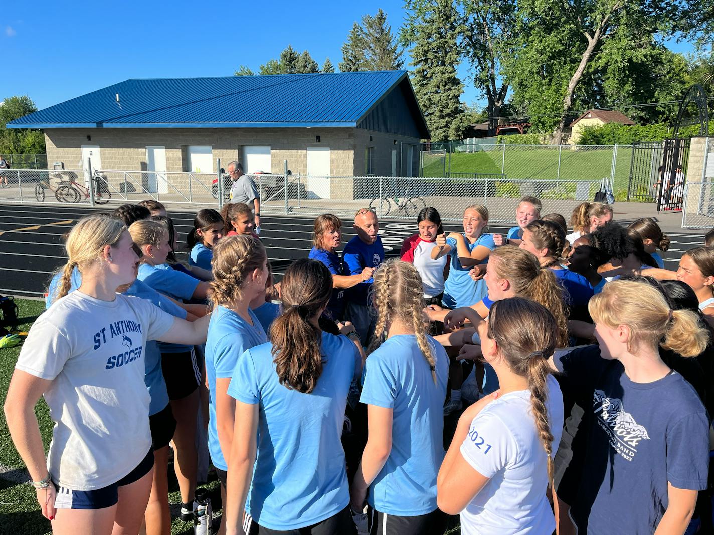 St. Anthony Village High School girls soccer co-head coaches Sue and Paul Pawlyshyn broke a huddle Monday with their varsity and junior varsity players to conclude their first practice of the fall at Dennison Field in Saint Anthony, Minnesota. Noah Furtado, Star Tribune