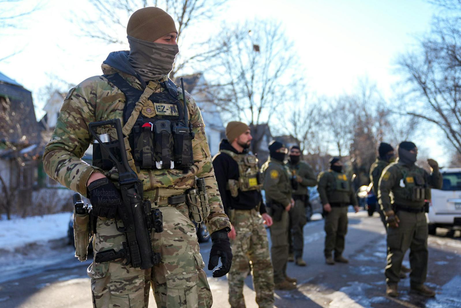 ICE agents gather near 31st Avenue N. and 3rd Street on Jan. 14 in Minneapolis.