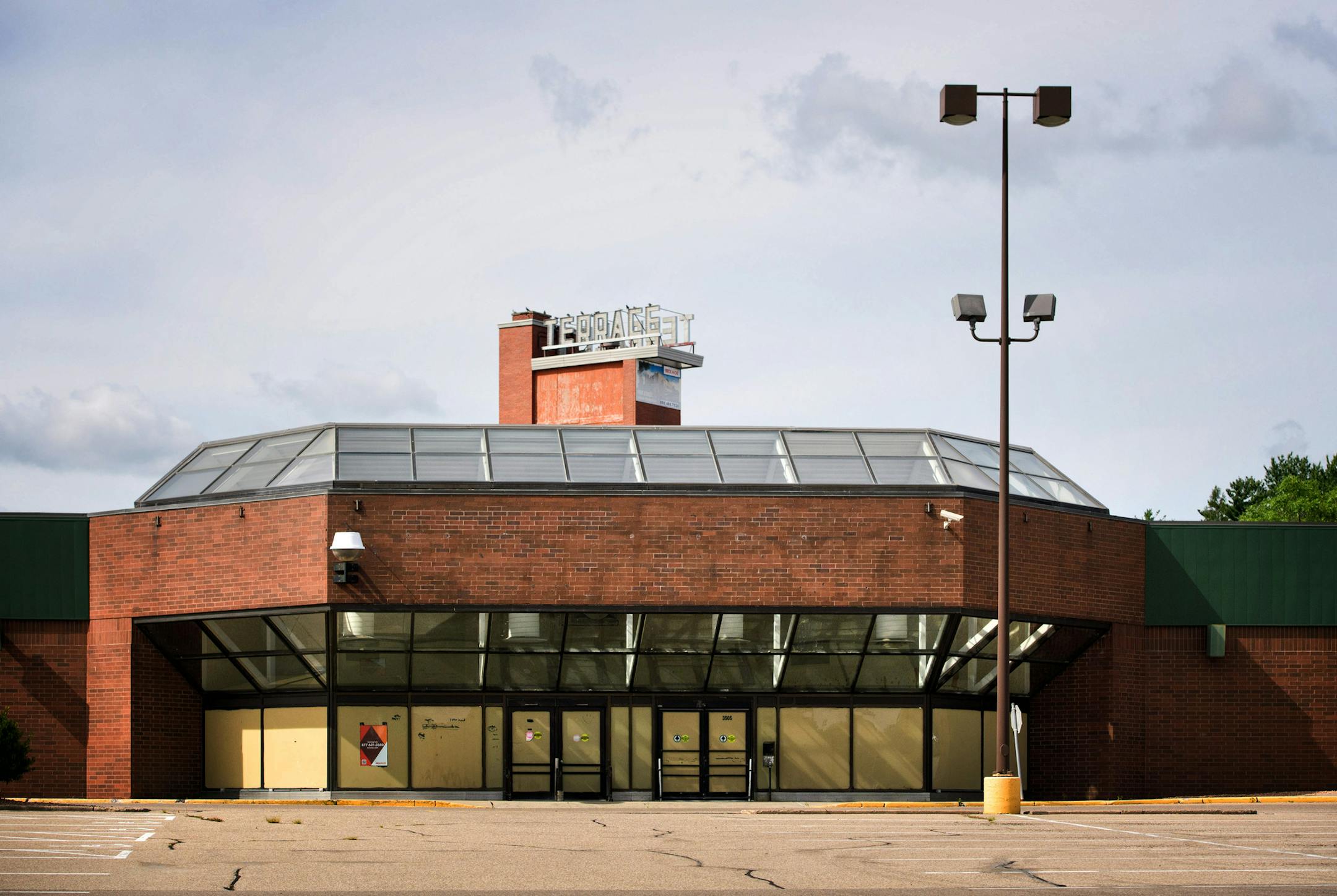 The Terrace Theater sits behind the Terrace Mall in Robbinsdale. ] GLEN STUBBE * gstubbe@startribune.com Friday, August 26, 2016 The Terrace Theater has sat vacant for more than a decade but it's been a focal point of late and preservationists and Robbinsdale debate whether to allow a Hy-Vee to take its place.
