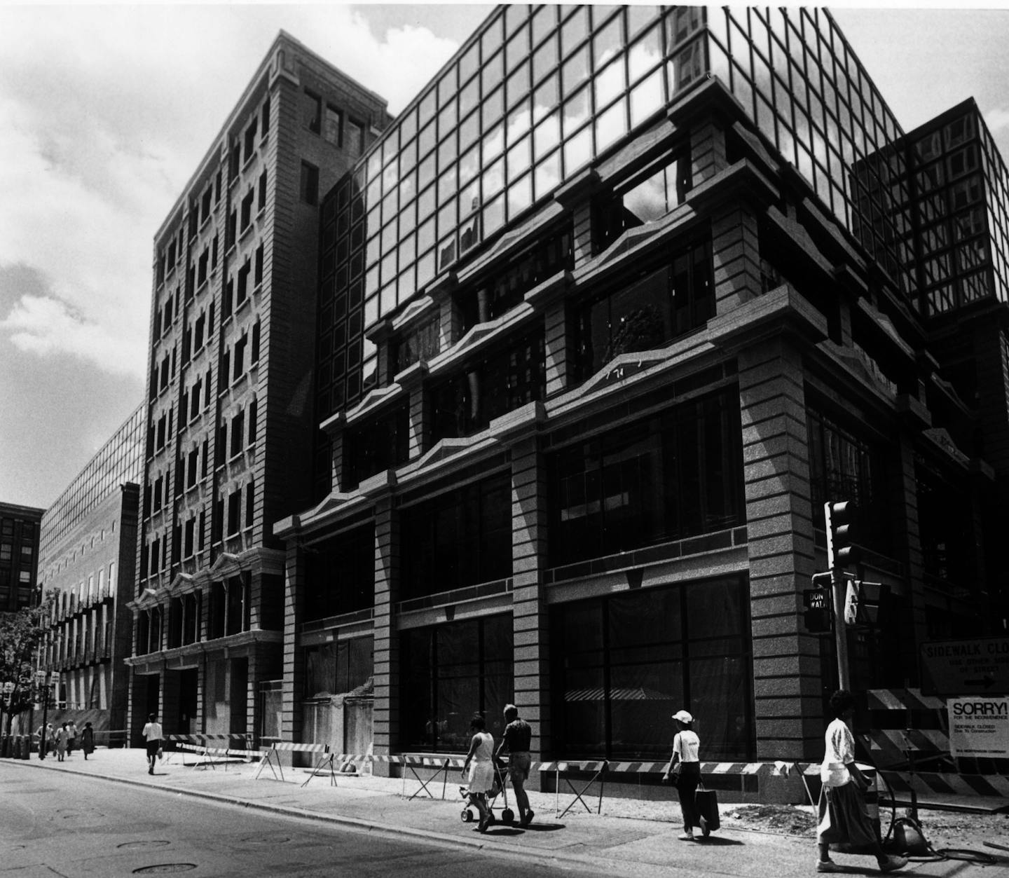 From a Star Tribune cutline of July 4, 1987: Construction crews finally took the wraps off the Conservatory, allowing passersby an unobstructed view of the granite and glass exterior of the retail complex being built on Nicollet Mall in downtown Minneapolis.