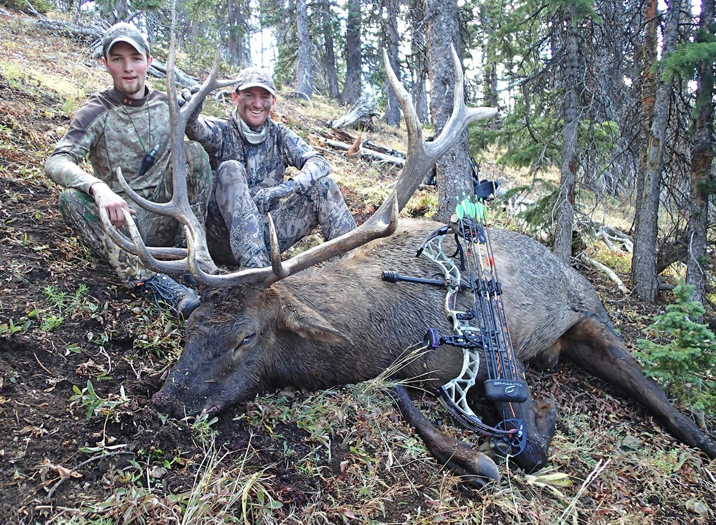 Friends and hunting partners Alec Underwood, left, and Trevor Anderson help each other while stalking and calling elk. This time Underwood did much of the calling, while Anderson arrowed this big 6x6 bull elk.