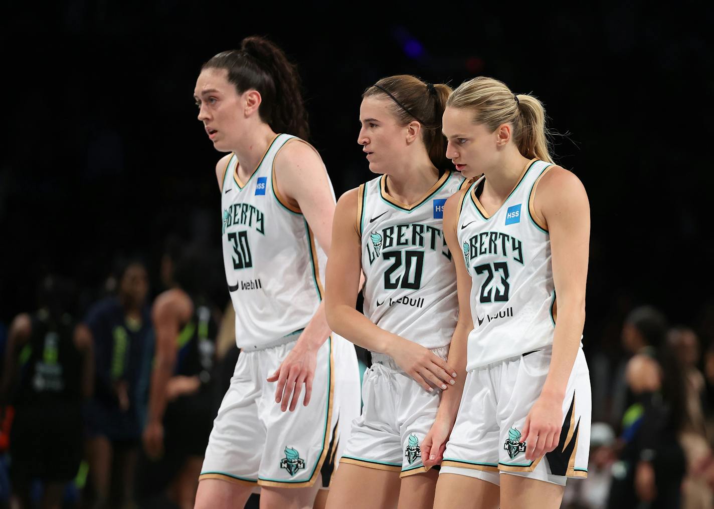 The New York Liberty's Breanna Stewart (30), Sabrina Ionescu (20), Marine Johannes (23) on the court against the Dallas Wings at Barclays Center on July 19, 2023, in New York. (Al Bello/Getty Images/TNS) ORG XMIT: 85220065W