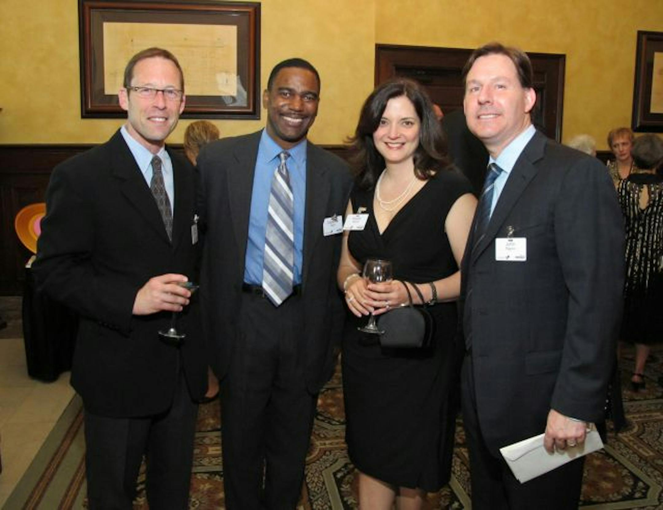 Psychologist John Cooper, Clarence Nunn, president and CEO of GE capital fleet services, and Nicole and John Righini, chief marketing officer at GE.