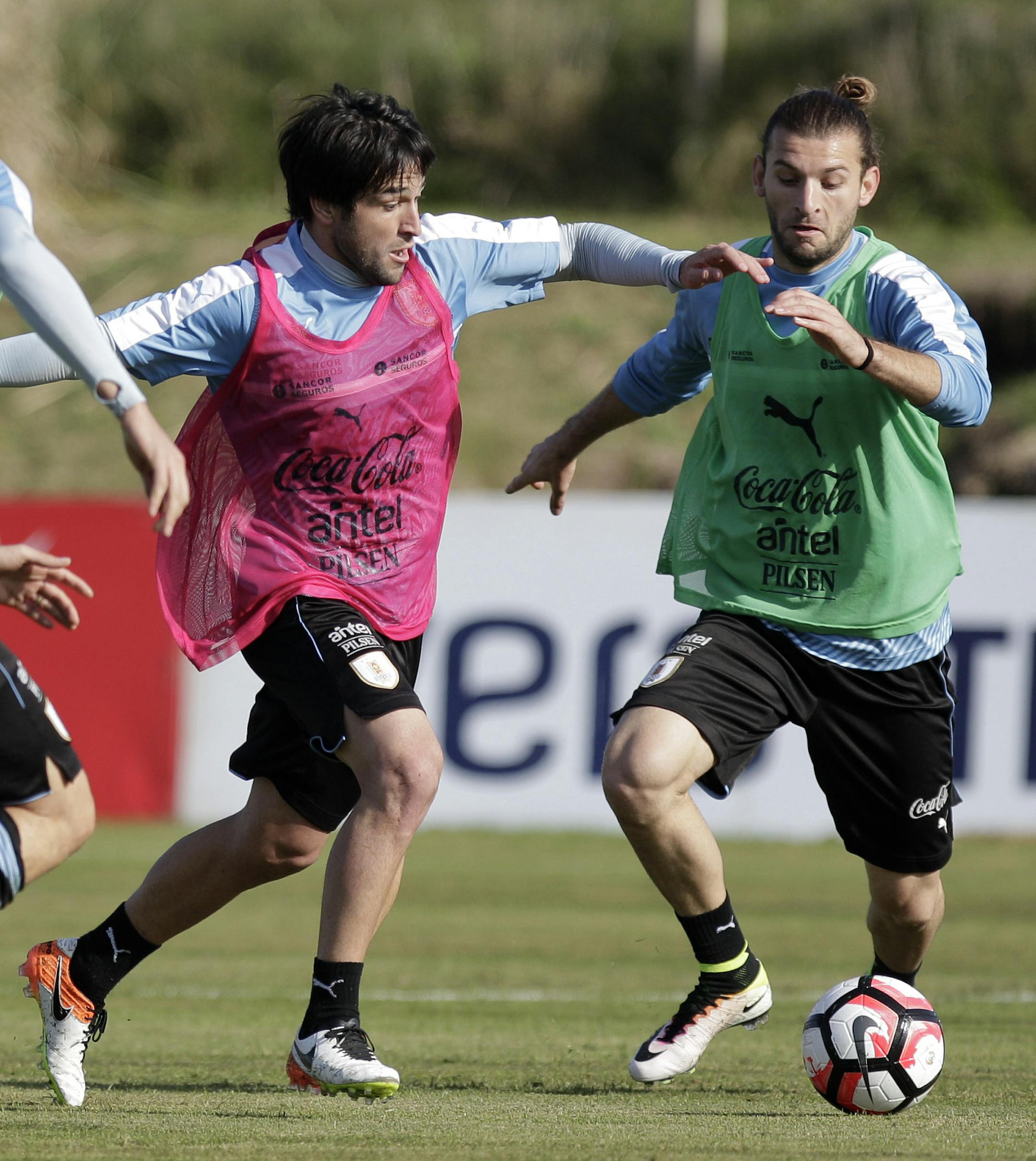 Uruguay&#xa5;s Nicolas Lodeiro, center, fights for the ball with Gaston Silva, right, during a training session in Montevideo, Uruguay, Tuesday, May 24, 2016. Uruguay's team is preparing for the Copa America Centenario, a tournament by the best national soccer teams from the American continent, hosted by the United States in June. (AP Photo/Matilde Campodonico)