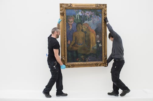 Employees place the work "Contes barbares" (Barbarian Tales) by French painter Paul Gaugin, during installation works for the upcoming exhibition in the Fondation Beyeler Museum in Riehen near Basel, Switzerland, Wednesday, Jan. 28, 2015. The Gaugin exhibition is dcheduled from Feb. 8 to June 28, 2015.