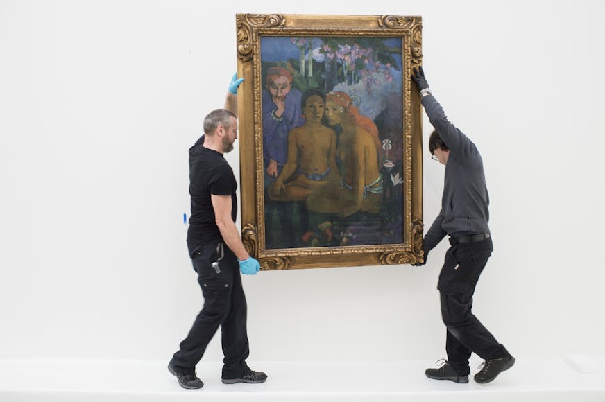 Employees place the work "Contes barbares" (Barbarian Tales) by French painter Paul Gaugin, during installation works for the upcoming exhibition in the Fondation Beyeler Museum in Riehen near Basel, Switzerland, Wednesday, Jan. 28, 2015. The Gaugin exhibition is dcheduled from Feb. 8 to June 28, 2015.