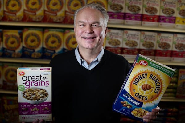 Chris Neugent is the President and CEO of Post Consumer Brands. He is holding his favorite cereals.