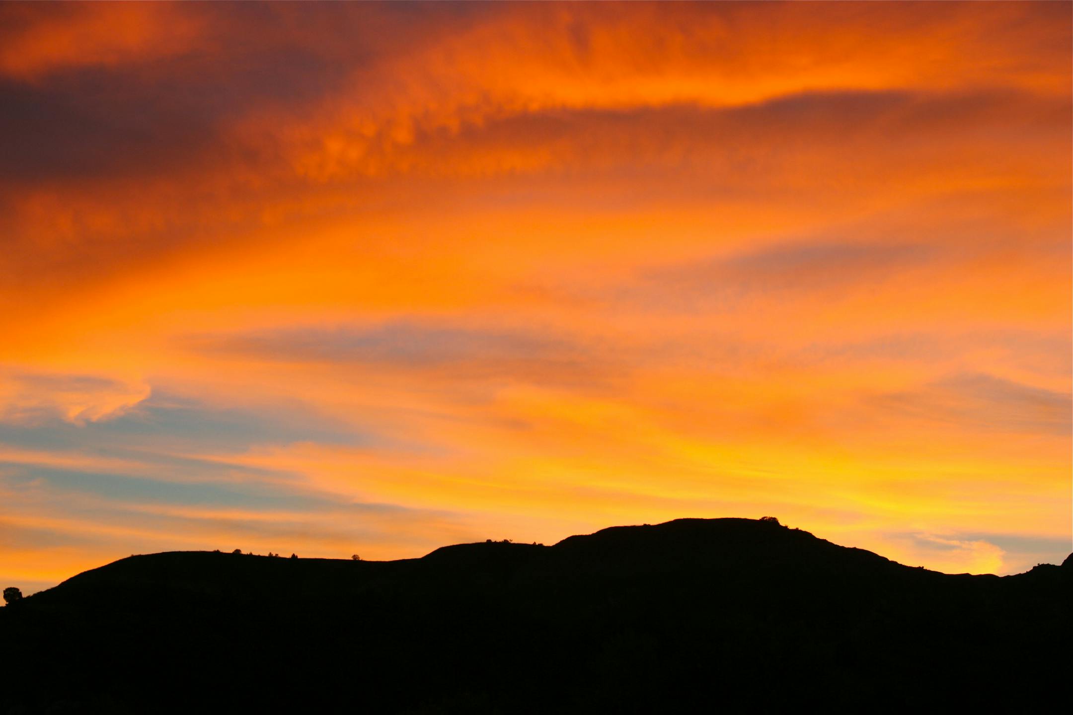 Photo by Tom Anderson. A golden September sunset looking west from the park's Cottonwood Campground.